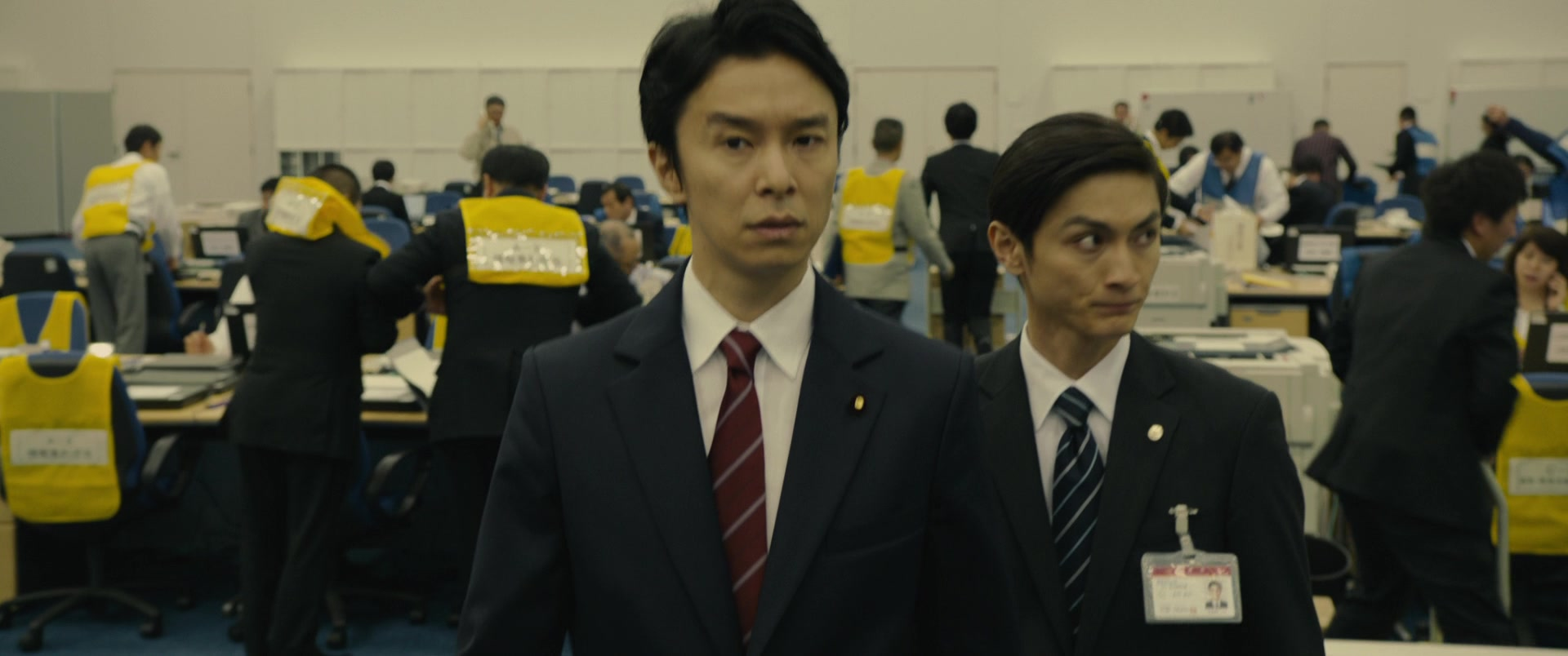 Government workers gather in an emergency briefing in Shin Godzilla