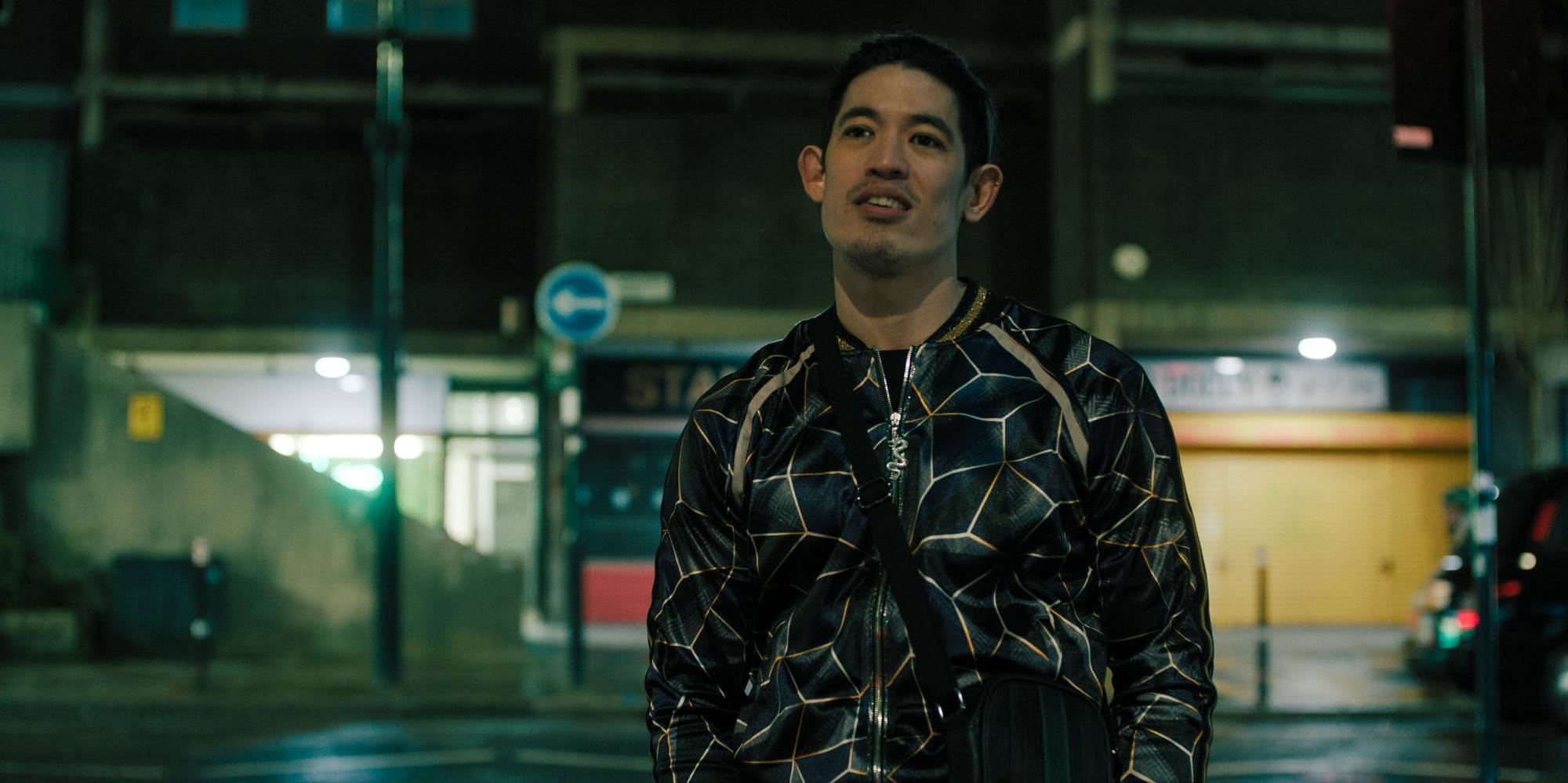 Christopher Chung wearing a ridiculous tracksuit in Slow Horses