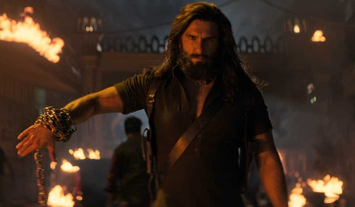 Ranveer Singh strikes an action star pose with a chain around his arm in Dhurandhar: The Revenge