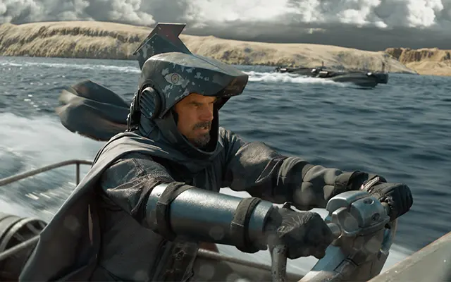 A man with a hammerhead helmet who I assume has to be Hammerhead pilots a fast boat in Storm Rider: Legend of Hammerhead