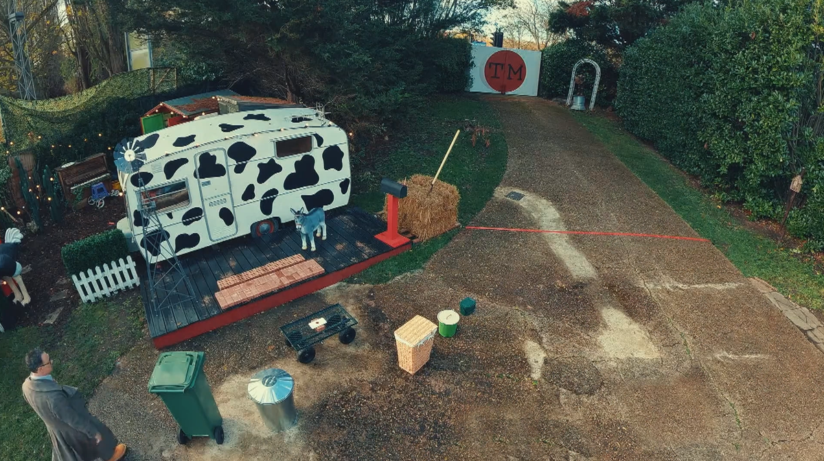 A Taskmaster task is set up, with bricks, a trolley, and some bins, as Reece Shearsmith approaches